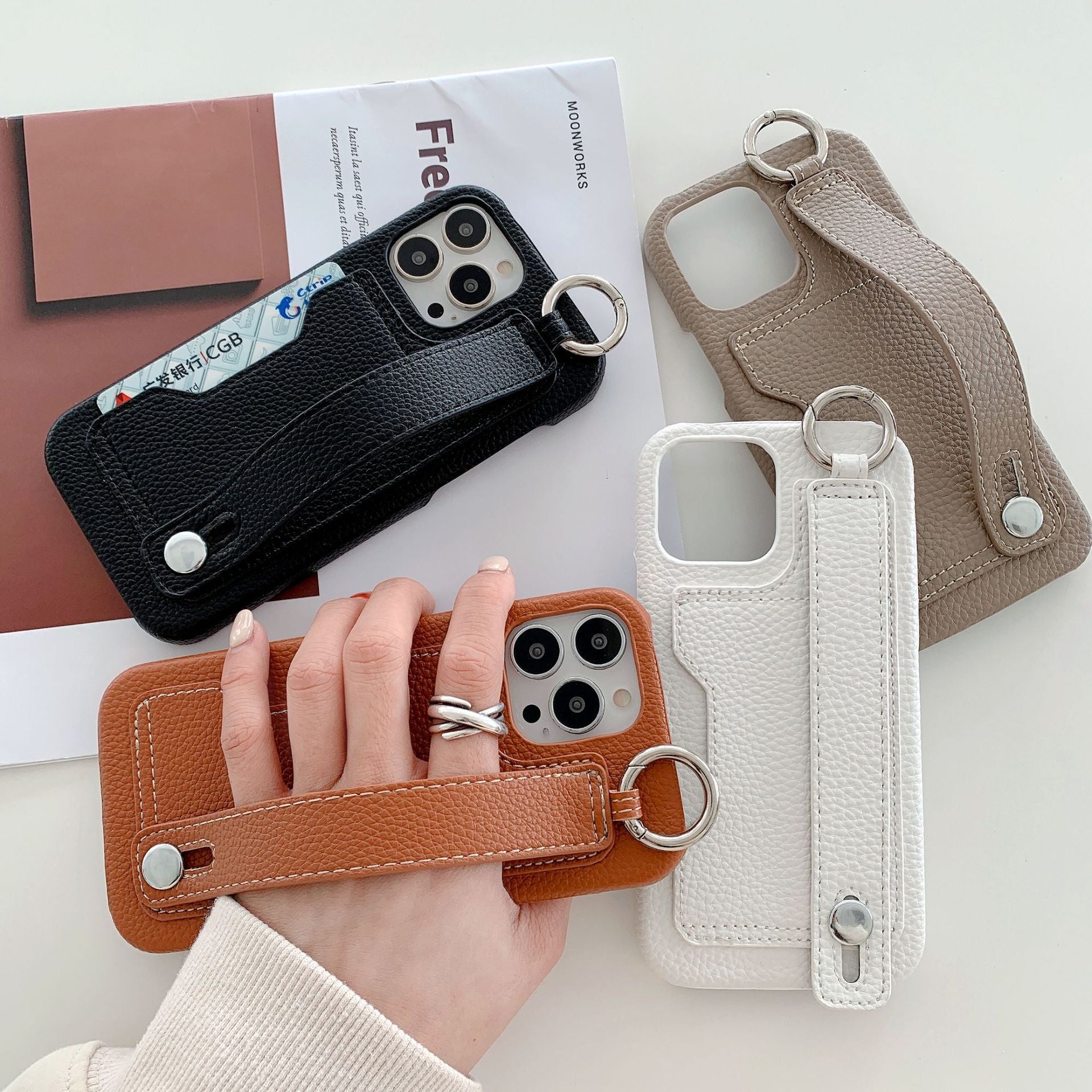 Leather phone case suitable for iPhone, with card slot and wrist strap protection